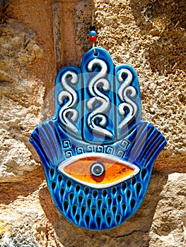 Blue ceramic souvenir of palm with eye in it, called Hamsa hand. Side, Turkey