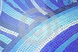 Blue ceramic tile mosaic design in swimming pool.