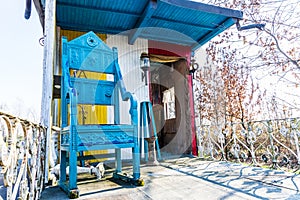 Blue chair on caravan porch