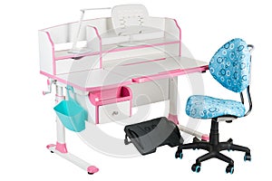 Blue chair, pink school desk, blue basket, desk lamp and black support under legs