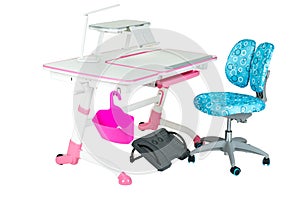 Blue chair, pink school desk, pink basket, desk lamp and black support under legs