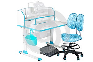 Blue chair, school desk, blue basket, desk lamp and black support under legs