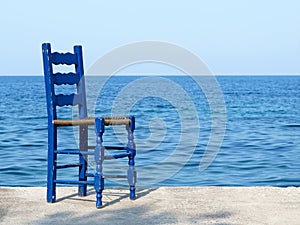 Blue chair at the sea in Greece