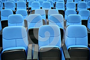 Blue chair seats in empty conference room