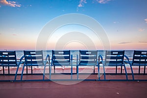 Blue chairs on the Promenade des Anglais in Nice France