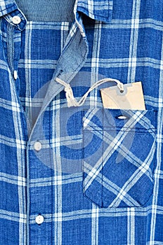 Blue checked shirt with price tag