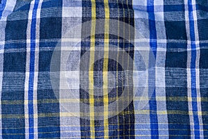 Blue checkered fabric with blue stripes as the background