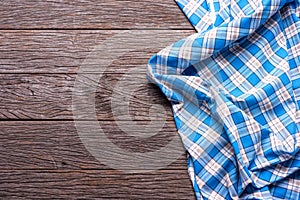 Blue Checkered Fabric on wood Background