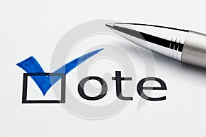 Blue checkmark on vote checkbox, pen on ballot photo