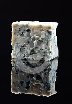 Blue cheese on a black background