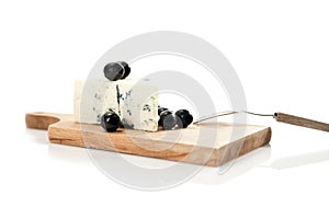 Blue cheese and black olives on cheeseboard