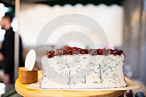 Blue cheese covered in berries