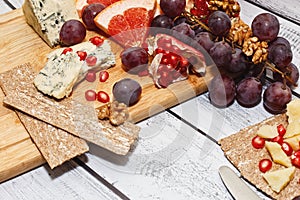 Blue cheese with fruits and crackers, snack idea