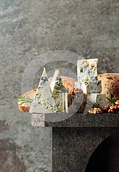 Blue cheese with walnuts, bread, and rosemary