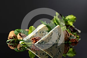 Blue cheese with walnuts and fresh greens