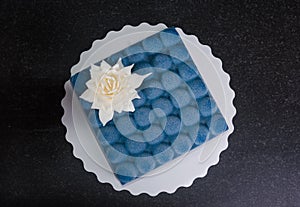 Blue chocolate velour cake with flower