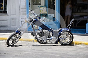 Blue motorcycle chopper parked on the street