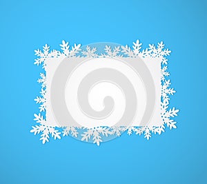 Blue Christmas background with paper snowflakes.