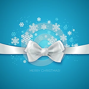 Blue Christmas background with white silk bow