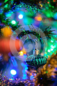 Blue Christmas ball decoration hanged up on a Christmas tree with nice blurry background