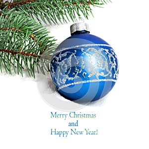 Blue Christmas ball and green spruce branch