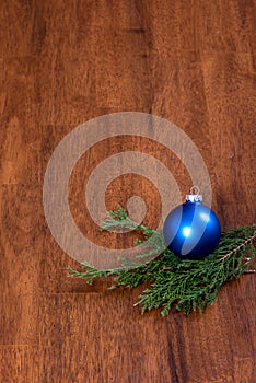 Blue Christmas Ball Ornament on Wood