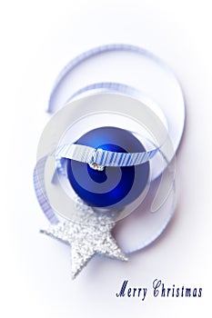 Blue christmas ball with ribbon and star