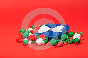 Blue Christmas gift box on red background