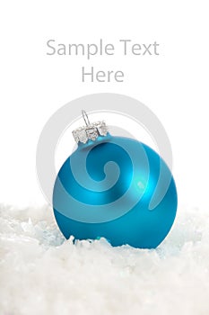 A blue Christmas ornament/bauble with copy space