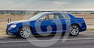 Blue Chrysler 300 in Badlands National Park