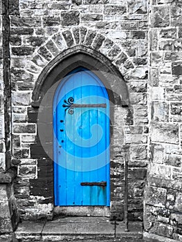 A blue church door Penzance Cornwall with saturated blue and grey stonework photo