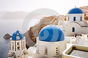 Blue churches of Oia village and sea at Santorini island, Greece