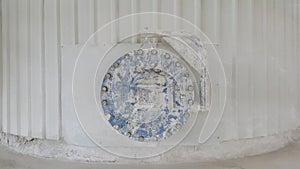 Blue circle manhole on wall can open /close for maintenance inside kiln in factory