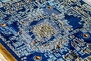 Blue circuit board PCB with many microscopic electronic parts