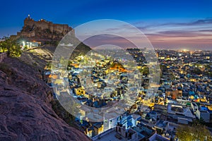 Blue city and Mehrangarh fort on the hill at night in Jodhpur