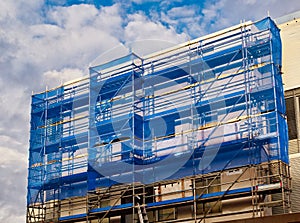 Blue Cladding on Building Scaffolding photo