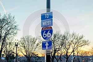 Blue Classic American Interstate 66 Street Sign. Directional Symbol, Arrow Pointing to West in Washington DC at Sunset.