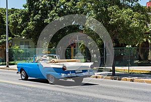 Blue classic cabriolet car drived trough Varadero in Cuba