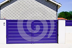 Blue classic portal modern house gate door to access garage home garden