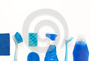 Blue cleaning kit of bottles, spray, brushes, sponge