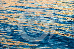 Blue clear water. Beautiful blue sea wave photograph close up. Beach vacation at sea or ocean