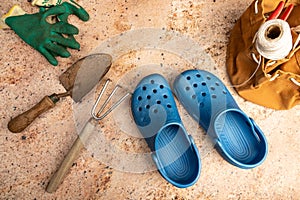 Blue Clogs and Garden Tools