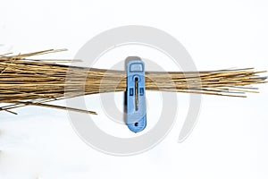 blue clothespins and broom sticks