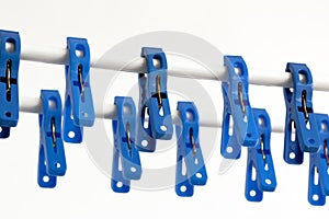 Blue clothespins on a string