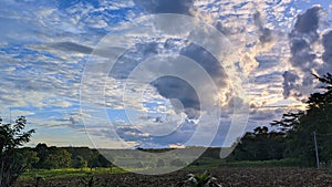 Blue cloud over the village sundown