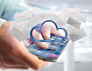 Blue cloud surrounded by realistic envelope email displayed on a