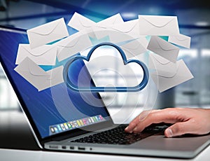 Blue cloud surrounded by realistic envelope email displayed on a