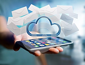 Blue cloud surrounded by realistic envelope email displayed on a