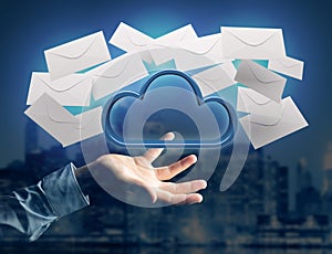 Blue cloud surrounded by realistic envelope email displayed on a