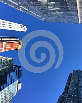 Blue cloudless sky skyscrapers under construction